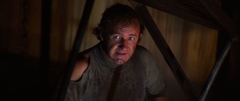 Movie still from “The Poseidon Adventure” (1972), directed by Ronald Neame – A person wearing a shirt and a tie; Close Up shot, Low angle