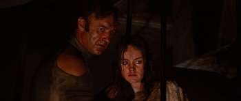 Movie still from “The Poseidon Adventure” (1972), directed by Ronald Neame – A man and a woman standing next to each other in the dark; Close Up shot, Low angle