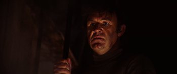 Movie still from “The Poseidon Adventure” (1972), directed by Ronald Neame – A person holding an umbrella in the dark; Close Up shot, Low angle