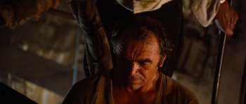 Movie still from “The Poseidon Adventure” (1972), directed by Ronald Neame – An old man with a beard is looking at the camera; Close Up shot, Low angle