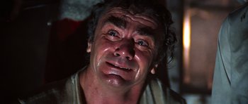 Movie still from “The Poseidon Adventure” (1972), directed by Ronald Neame – An old man is looking at the camera; Close Up shot, Low angle