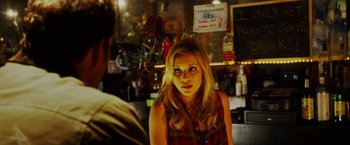 Movie still from “The Prince” (2014), directed by Brian A. Miller – A woman in a plaid shirt sitting in front of a man; Close Up shot, Over the shoulder angle