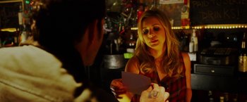 Movie still from “The Prince” (2014), directed by Brian A. Miller – A man and a woman are looking at a piece of paper; Close Up shot, Over the shoulder angle