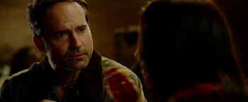 Movie still from “The Prince” (2014), directed by Brian A. Miller – A man and a woman looking at one another in the mirror; Close Up shot, Over the shoulder angle