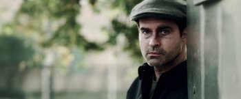 Movie still from “The Prince” (2014), directed by Brian A. Miller – A person wearing a hat; Close Up shot, Low angle