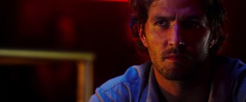 Movie still from “The Prince” (2014), directed by Brian A. Miller – A person wearing a blue shirt; Close Up shot, Low angle
