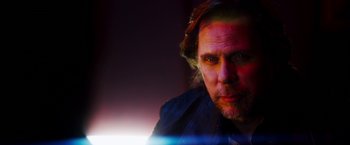 Movie still from “The Prince” (2014), directed by Brian A. Miller – A person wearing a jacket; Close Up shot, Low angle