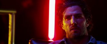 Movie still from “The Prince” (2014), directed by Brian A. Miller – A person in a dark room; Close Up shot, Low angle