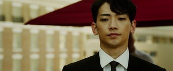 Movie still from “The Prince” (2014), directed by Brian A. Miller – A man in a suit and tie looking at the camera; Close Up shot, Low angle