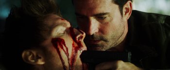 Movie still from “The Prince” (2014), directed by Brian A. Miller – A man with blood on his face is looking at a woman with blood on her face; Close Up shot, Over the shoulder angle