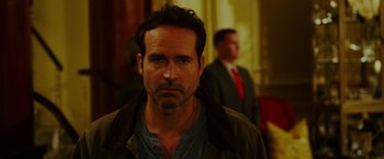 Movie still from “The Prince” (2014), directed by Brian A. Miller – A person wearing a jacket; Close Up shot, Over the shoulder angle