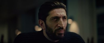 Movie still from “Journal 64” (2018), directed by Christoffer Boe – A person with a beard; Close Up shot, Low angle