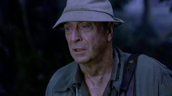 Movie still from “The Quiet American” (2002), directed by Phillip Noyce – A person wearing a hat; Close Up shot, Low angle