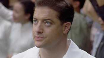 Movie still from “The Quiet American” (2002), directed by Phillip Noyce – A person wearing a white shirt; Close Up shot, Low angle