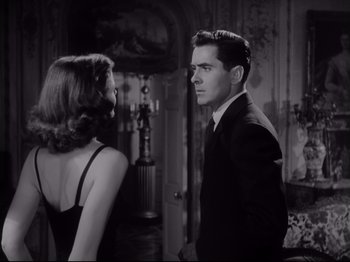 Movie still from “The Razor's Edge” (1946), directed by Edmund Goulding – A man and a woman standing next to each other in a room; Medium shot, Low angle