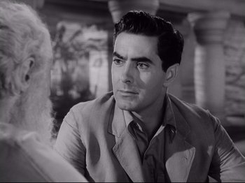 Movie still from “The Razor's Edge” (1946), directed by Edmund Goulding – Black and white photograph of a man in a suit; Close Up shot, Over the shoulder angle