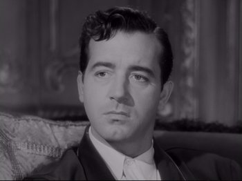 Movie still from “The Razor's Edge” (1946), directed by Edmund Goulding – A black - and - white photo of a man in a suit and tie; Close Up shot, Low angle