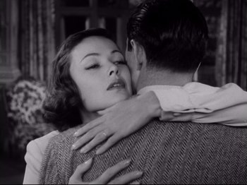 Movie still from “The Razor's Edge” (1946), directed by Edmund Goulding – An old photo of a woman hugging a young man; Close Up shot, Low angle