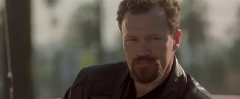 Movie still from “The Replacement Killers” (1998), directed by Antoine Fuqua – A person with a beard; Close Up shot, Low angle