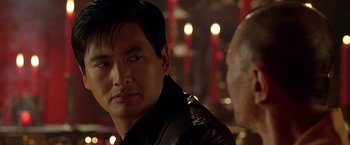 Movie still from “The Replacement Killers” (1998), directed by Antoine Fuqua – A person wearing a leather jacket; Close Up shot, Over the shoulder angle