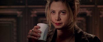 Movie still from “The Replacement Killers” (1998), directed by Antoine Fuqua – A person holding a cup of coffee; Close Up shot, Low angle