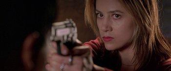 Movie still from “The Replacement Killers” (1998), directed by Antoine Fuqua – A person holding a gun; Close Up shot, Low angle