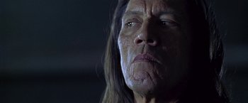 Movie still from “The Replacement Killers” (1998), directed by Antoine Fuqua – An old woman with long black hair looking at the camera; Close Up shot, Low angle