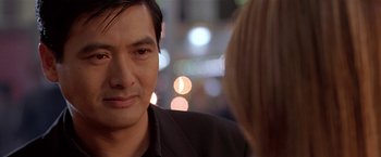 Movie still from “The Replacement Killers” (1998), directed by Antoine Fuqua – A person looking at the camera; Close Up shot, Over the shoulder angle