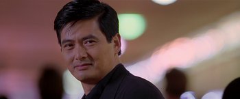 Movie still from “The Replacement Killers” (1998), directed by Antoine Fuqua – A person wearing a black shirt; Close Up shot, Low angle