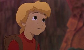 Movie still from “The Rescuers Down Under” (1990), directed by Mike Gabriel – A young boy with blonde hair and a red shirt; Close Up shot, Low angle