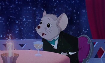 Movie still from “The Rescuers Down Under” (1990), directed by Mike Gabriel – A mouse sitting at a table with a glass of wine in front of him; Medium shot, Over the shoulder angle