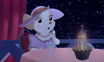 Movie still from “The Rescuers Down Under” (1990), directed by Mike Gabriel – A mouse sitting at a table with a glass of wine; Medium shot, High angle