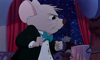 Movie still from “The Rescuers Down Under” (1990), directed by Mike Gabriel – A mouse wearing a tuxedo standing in front of a table; Medium shot, Over the shoulder angle