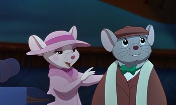 Movie still from “The Rescuers Down Under” (1990), directed by Mike Gabriel – A woman and a man dressed as a mouse; Close Up shot, Over the shoulder angle
