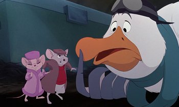 Movie still from “The Rescuers Down Under” (1990), directed by Mike Gabriel – A mouse and a rat are looking at a duck; Medium shot, Over the shoulder angle