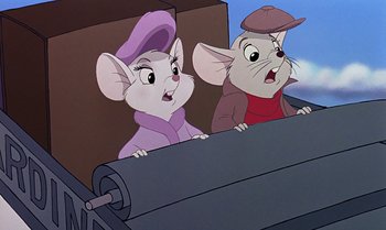 Movie still from “The Rescuers Down Under” (1990), directed by Mike Gabriel – A couple of mice are sitting in a train car; Close Up shot, Over the shoulder angle