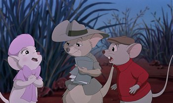 Movie still from “The Rescuers Down Under” (1990), directed by Mike Gabriel – A group of cartoon characters standing next to each other on a field; Medium shot, Over the shoulder angle
