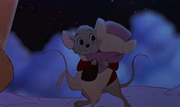 Movie still from “The Rescuers Down Under” (1990), directed by Mike Gabriel – A mouse holding a stuffed animal in its arms; Medium shot, High angle