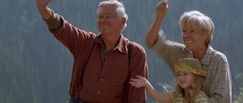 Movie still from “The River Wild” (1994), directed by Curtis Hanson – An older man and a young man are dancing; Medium shot, Low angle