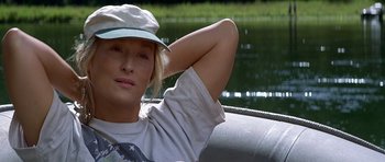 Movie still from “The River Wild” (1994), directed by Curtis Hanson – A woman in a hat sitting in a boat; Close Up shot, Over the shoulder angle