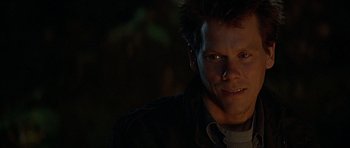 Movie still from “The River Wild” (1994), directed by Curtis Hanson – A person wearing a jacket; Close Up shot, Low angle