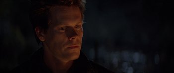 Movie still from “The River Wild” (1994), directed by Curtis Hanson – A person looking at the camera; Close Up shot, High angle