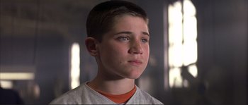 Movie still from “The Rookie” (2002), directed by John Lee Hancock – A young boy is looking into the distance; Close Up shot, Low angle