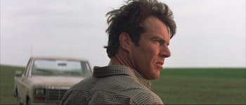 Movie still from “The Rookie” (2002), directed by John Lee Hancock – A person wearing a plaid shirt; Close Up shot, Low angle