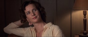 Movie still from “The Rookie” (2002), directed by John Lee Hancock – A woman in a yellow shirt looking to her left; Close Up shot, Low angle