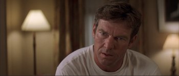 Movie still from “The Rookie” (2002), directed by John Lee Hancock – A man that is staring at the camera; Close Up shot, Over the shoulder angle