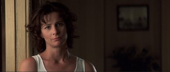 Movie still from “The Rookie” (2002), directed by John Lee Hancock – A person in a room; Close Up shot, Low angle