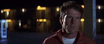 Movie still from “The Rookie” (2002), directed by John Lee Hancock – A person wearing a red shirt; Close Up shot, Low angle