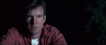 Movie still from “The Rookie” (2002), directed by John Lee Hancock – A person wearing a red shirt; Close Up shot, Low angle