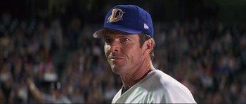 Movie still from “The Rookie” (2002), directed by John Lee Hancock – A baseball player wearing a hat; Close Up shot, Low angle